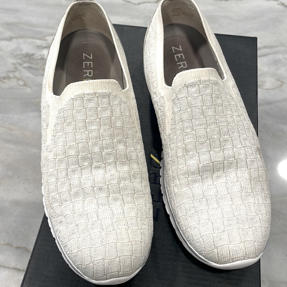 Zero grand by Cole Haan white with metallic silver thread.